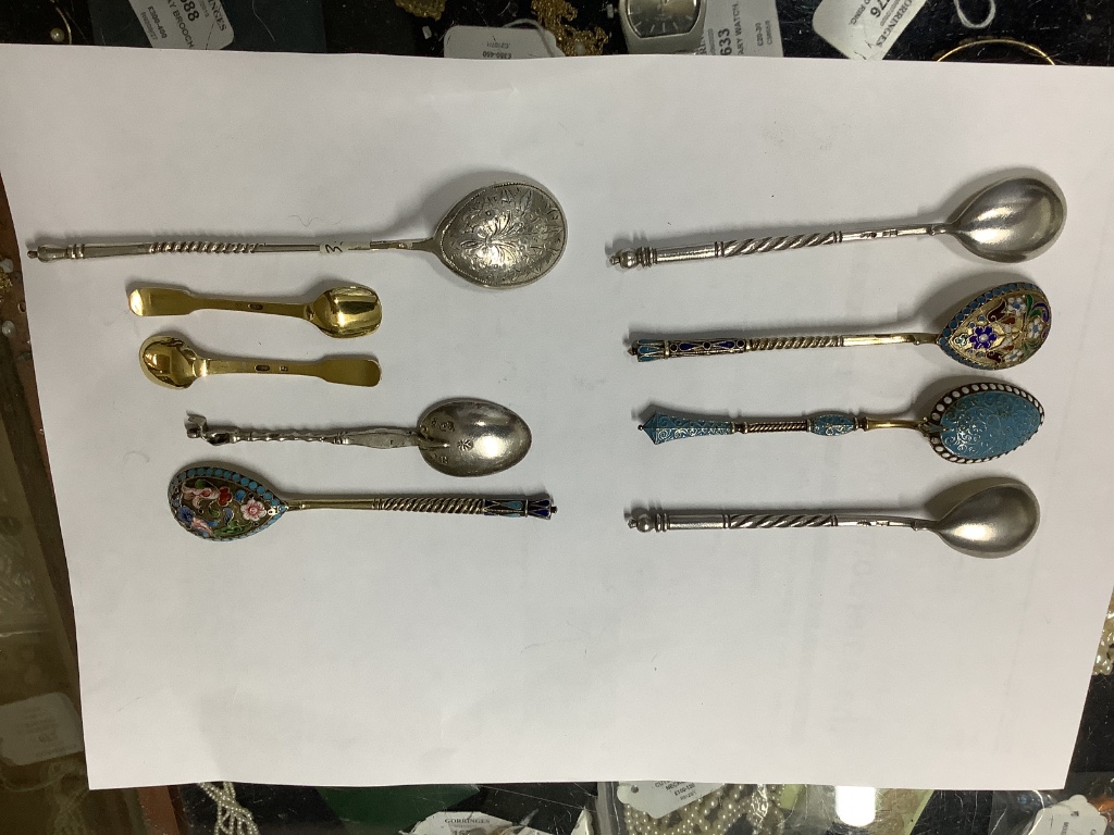 A small collection of Russian and Russian style white metal spoons etc, some with enamel or niello decoration.